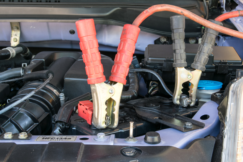 Charging battery car with electricity trough jumper cables, Seaside CA